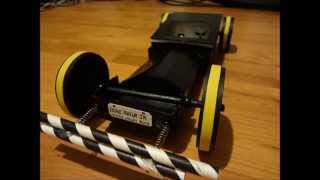 Cardboard electric rubber band driven car built for drag race competition.