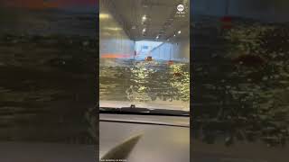 Frightened motorist drives through flooded tunnel