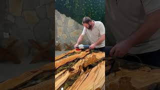 Our black and gold epoxy resin table made from olive wood! #diningtable #epoxytable #resin #wood