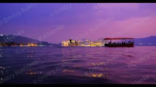 Udaipur Lake Palace Jag Niwas on island on lake Pichola with tourist boat. Sunset at Udaipur, India