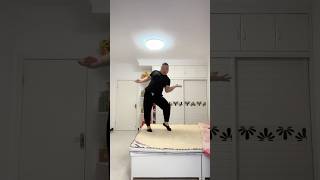 Chinese Man Dancing On Bed