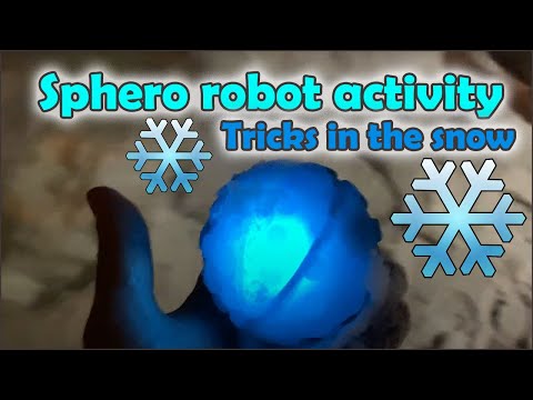 Sphero robot in a pile of snow doing tricks