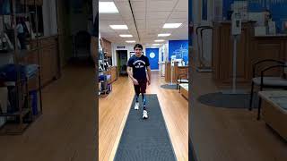 Bilateral Below-Knee Amputee Walking with Prosthetic Legs
