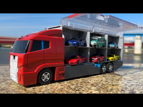 13 mini cars and a red convoy truck! Search and play at the fishing port.