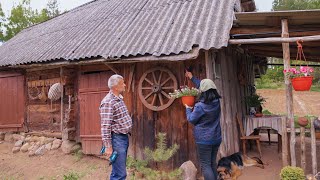 Village life. Traditional borscht in the summer kitchen. Cooking and restoring the house