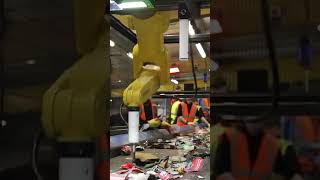 What is the FANUC robot doing? It's recycling would you believe!!
