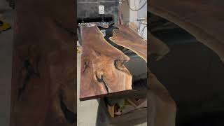 Incredible polishing of black walnut epoxy table