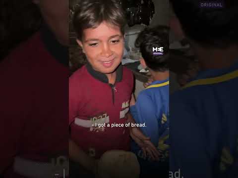 Gaza child expresses joy after obtaining piece of bread