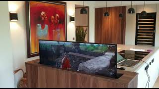 Future automation Oled 4K lift with swivel function for all viewing angles controlled by Control4