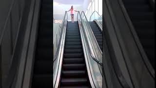 Lola on a moving sidewalk & escalator at the airport