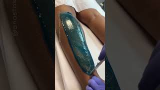 Lower leg wax service using blue hard wax formula from Starpil