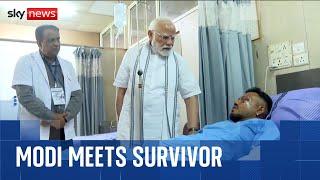 India's PM meets lone survivor and visits plane crash site