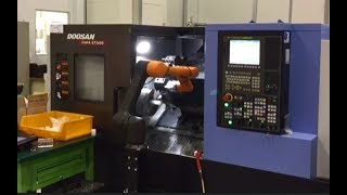 HYRobotics's HCR-5 ( Hanwha ) with Doosan CNC machine.