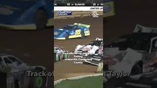 Racecar driver suspended from racetracks