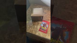 Opening a Metazoo pack with a Gucci watch