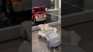 Optimus Prime knocks over mini robot