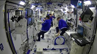 Chinese taikonauts conduct a series of experiments in space