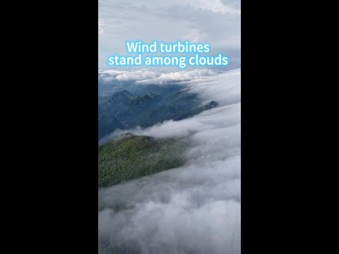 Wind turbines stand among clouds in SW China's Chongqing