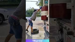 Barrel Meet Tire: A Love Story! 😂 Genius Unloading Level 9000! #worklife #funnyhacks #strong