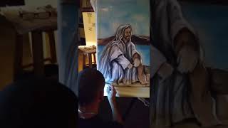 My hubby airbrushing a murial