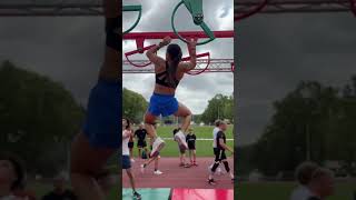 Athletes Conquering Obstacle Course at European Track Stadium